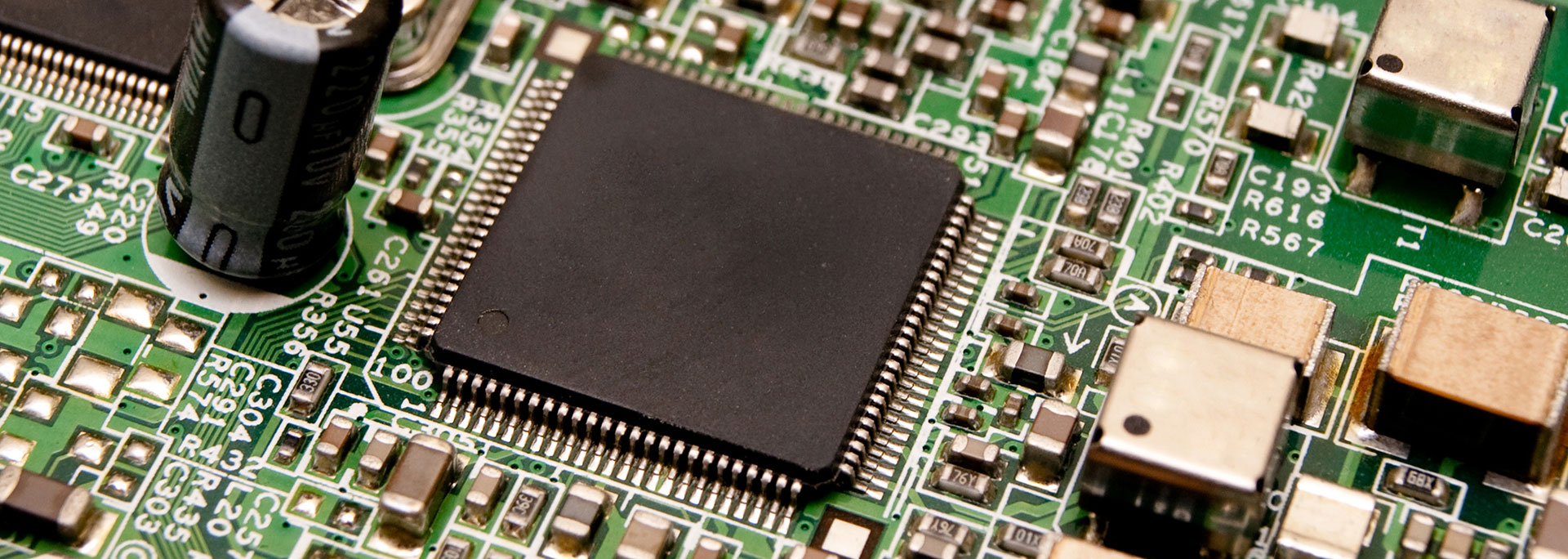 A microchip sits on a circuit board.